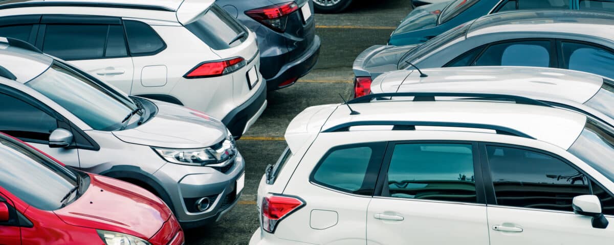 Car parked at parking lot of the airport for rental. Aerial view of car parking lot of the airport. Used luxury car for sale and rental service. Automobile parking space. Car dealership concept.